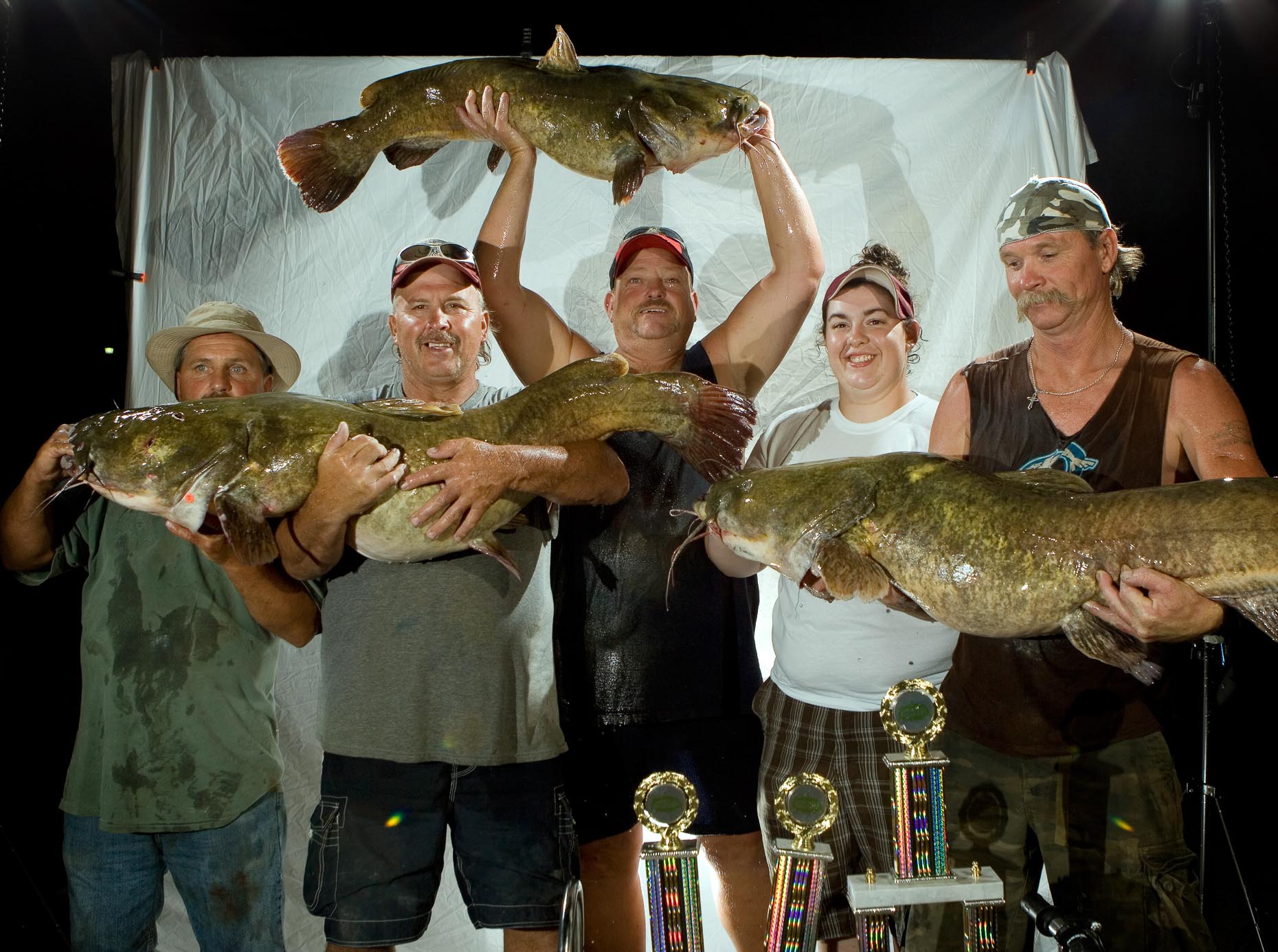 Okie noodling contestants pose for a portrait in Pauls Valley, Oklahoma. 