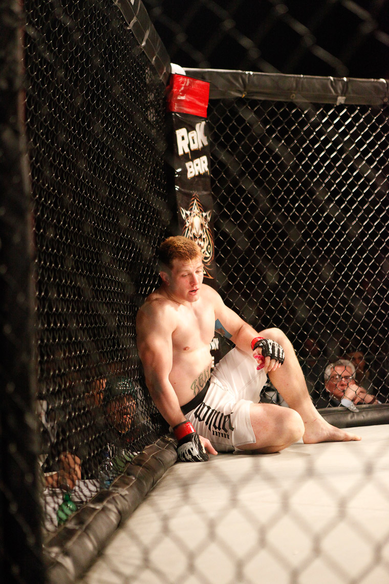 MMA fighter after being knocked down in the octagon. 